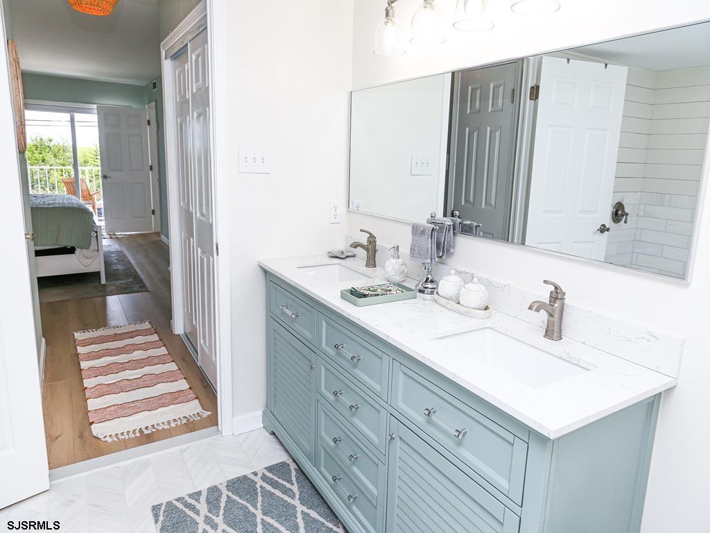 3901 Ocean Avenue, Unit 1 Brigantine, NJ 08203 - Photo 19 of 30 a bathroom with a sink and a mirror