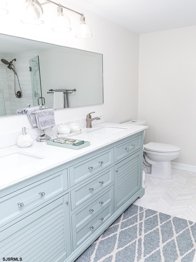 3901 Ocean Avenue, Unit 1 Brigantine, NJ 08203 - Photo 20 of 30 a bathroom with a double vanity sink mirror and