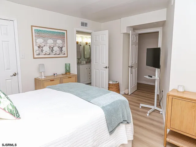 a bedroom with a bed and a view of bathroom