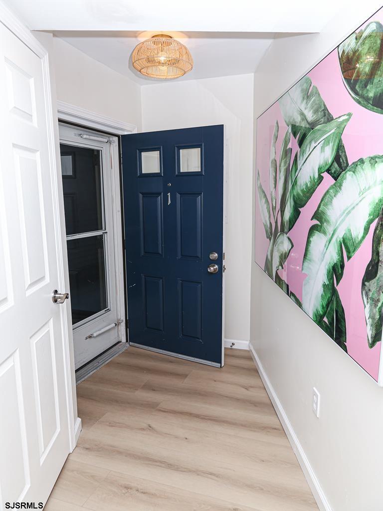 3901 Ocean Avenue, Unit 1 Brigantine, NJ 08203 - Photo 4 of 30 a view of a hallway with wooden floor