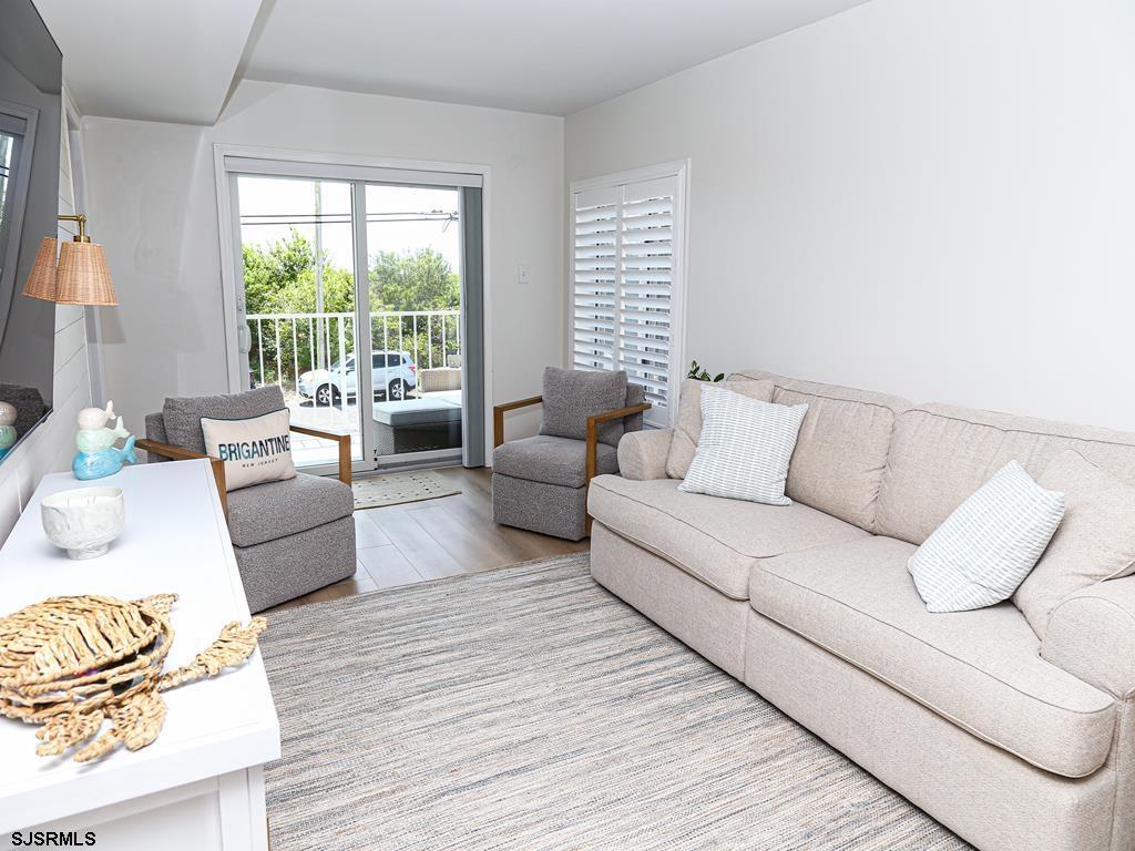 3901 Ocean Avenue, Unit 1 Brigantine, NJ 08203 - Photo 5 of 30 a living room with furniture and a couch