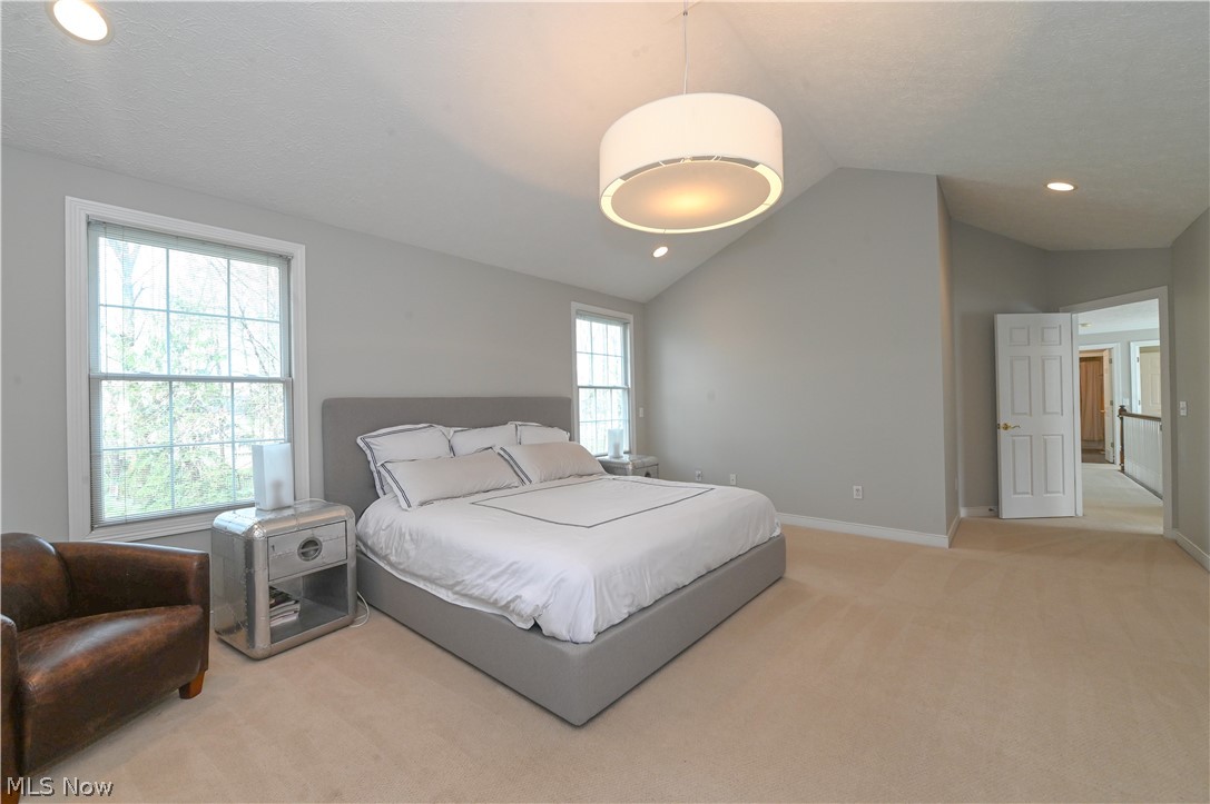1688 Sheridan Road South Euclid, OH 44121 - Photo 21 of 48 Bedroom featuring light carpet and vaulted ceiling