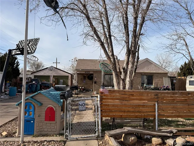 a view of a building with parking space