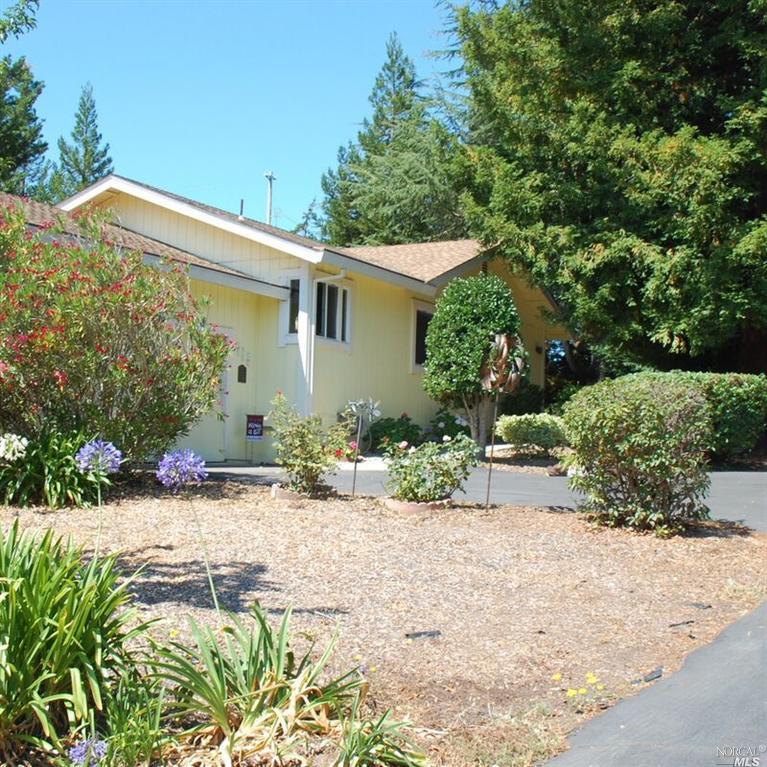 715 Sparkes Road Sebastopol, CA 95472 - Photo 1 of 1 a front view of a house with a yard and a garden