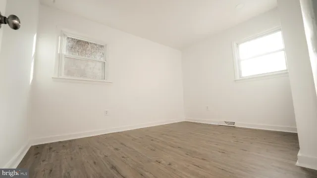 a bed room with a bed and a window