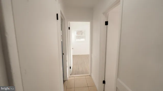 a bathroom with a tub sink and a mirror