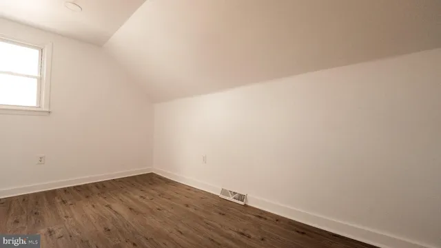 a kitchen with stainless steel appliances a stove and a microwave