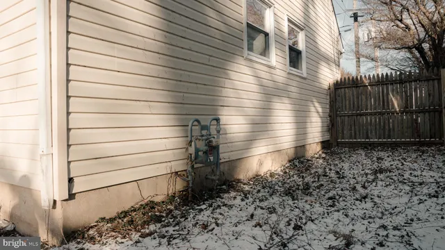 a view of a small space with wooden floor and a window