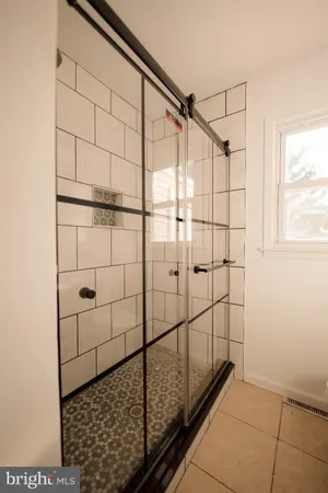 a kitchen with stainless steel appliances granite countertop a refrigerator a stove and a sink