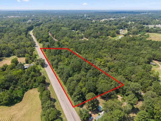 an aerial view of residential houses with outdoor space and garden