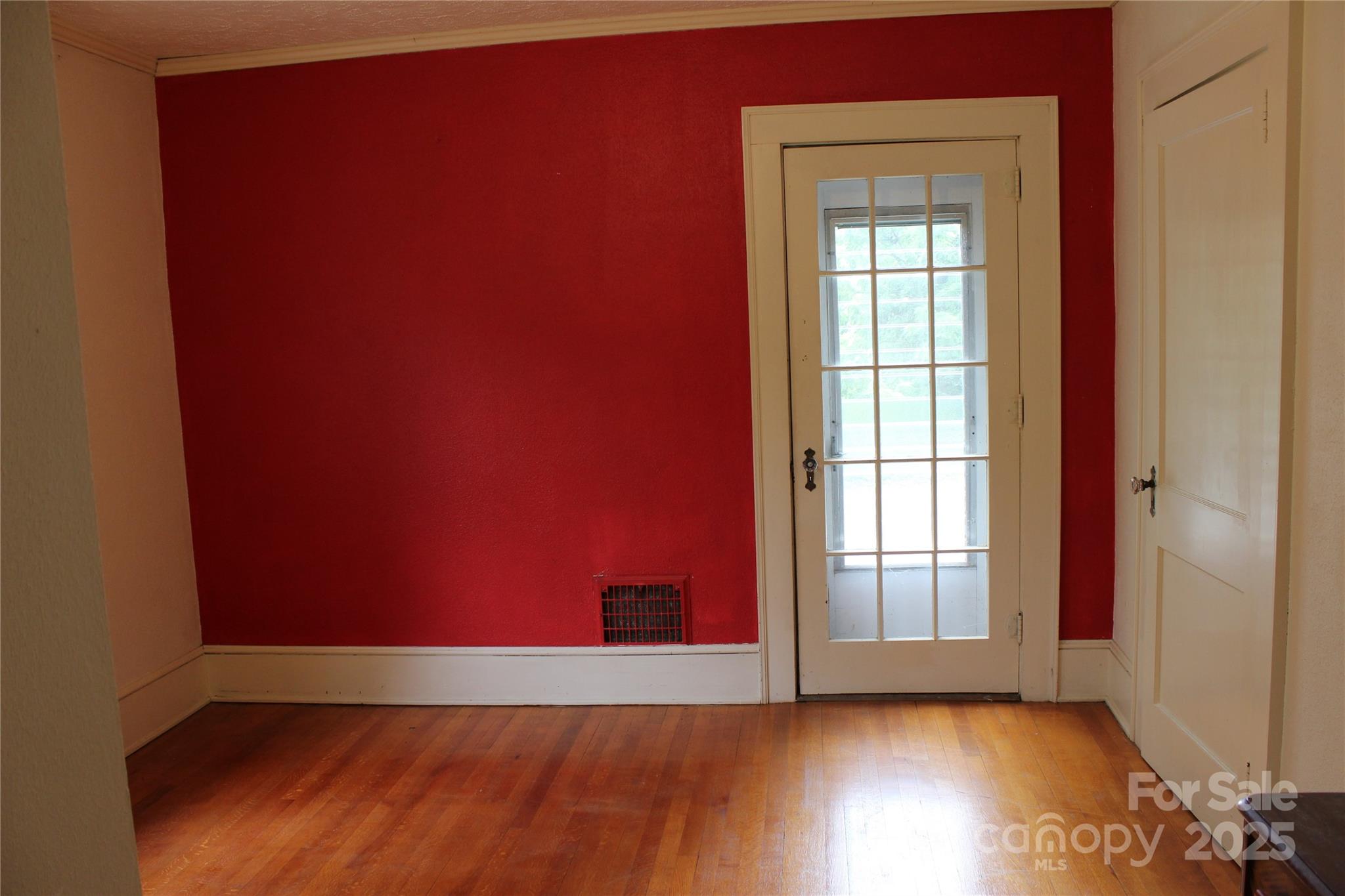 158 School House Road Mills River, NC 28759 - Photo 17 of 22 an empty room with wooden floor and windows