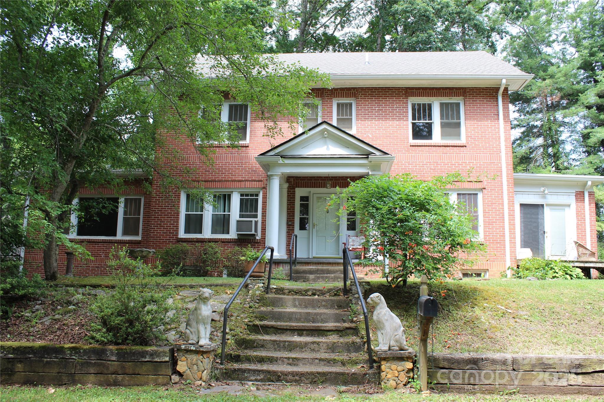 158 School House Road Mills River, NC 28759 - Photo 3 of 22 a front view of a house with garden