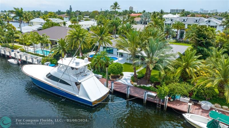 a view of a chairs and table in a backyard