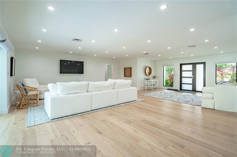 2375 Northeast 29th Street Lighthouse Point, FL 33064 - Photo 12 of 76 a living room with furniture and a flat screen tv