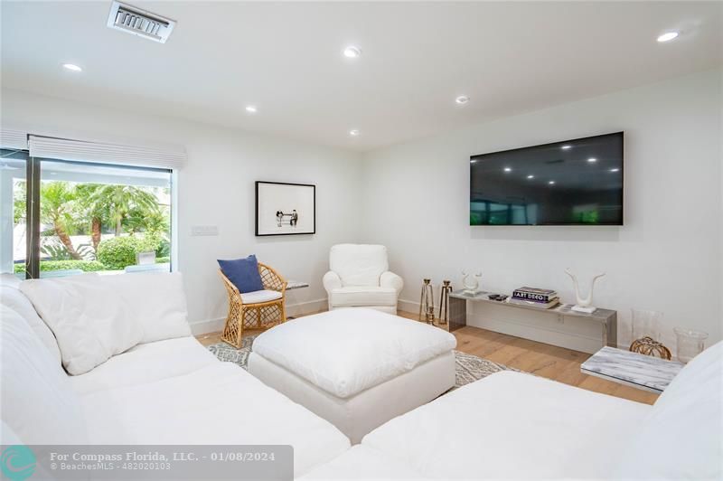 2375 Northeast 29th Street Lighthouse Point, FL 33064 - Photo 13 of 76 a living room with furniture and a flat screen tv