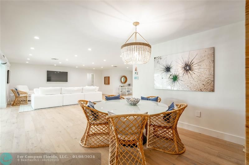 2375 Northeast 29th Street Lighthouse Point, FL 33064 - Photo 14 of 76 a view of a dining room with furniture and wooden floor