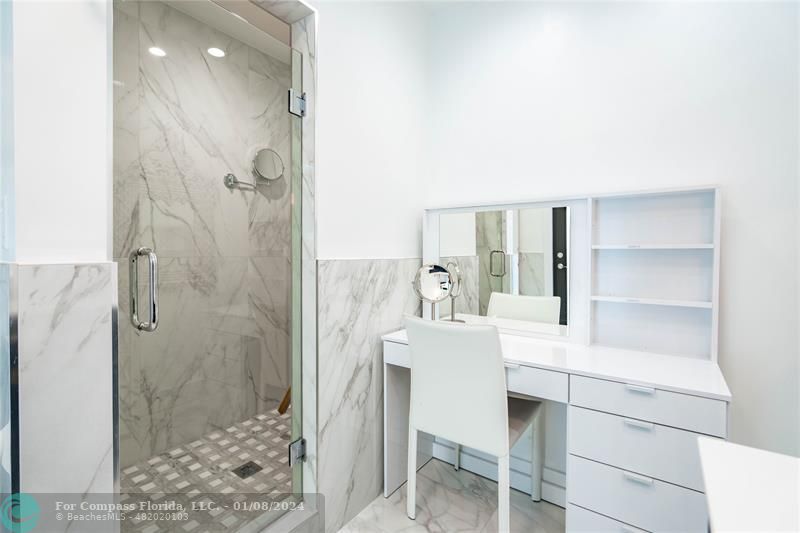 2375 Northeast 29th Street Lighthouse Point, FL 33064 - Photo 27 of 76 a bathroom with a sink and a mirror