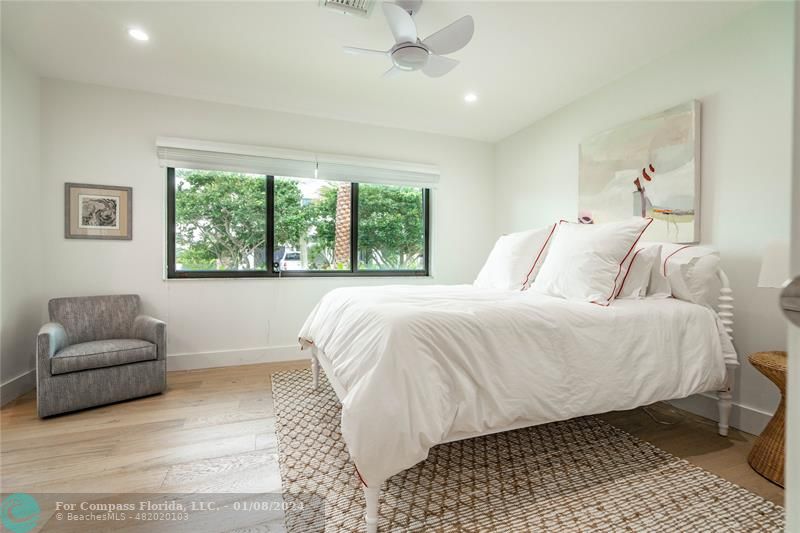 2375 Northeast 29th Street Lighthouse Point, FL 33064 - Photo 36 of 76 a spacious bedroom with a bed and a couch