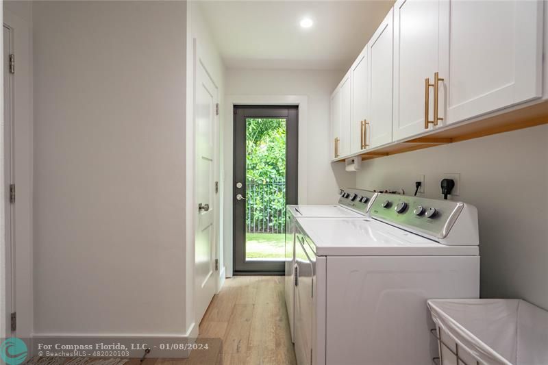 2375 Northeast 29th Street Lighthouse Point, FL 33064 - Photo 38 of 76 a utility room with dryer and washer