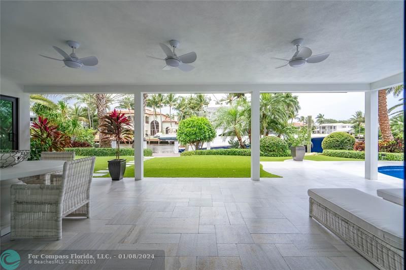 2375 Northeast 29th Street Lighthouse Point, FL 33064 - Photo 42 of 76 a view of backyard with swimming pool and outdoor seating