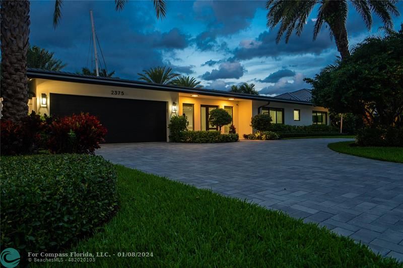 2375 Northeast 29th Street Lighthouse Point, FL 33064 - Photo 5 of 76 a front view of house with yard and green space