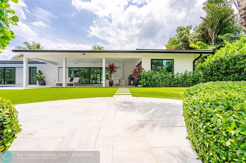 2375 Northeast 29th Street Lighthouse Point, FL 33064 - Photo 56 of 76 a view of yard with swimming pool and green space