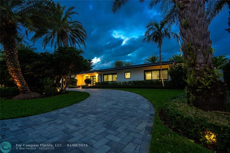 2375 Northeast 29th Street Lighthouse Point, FL 33064 - Photo 7 of 76 a front view of a house with a yard