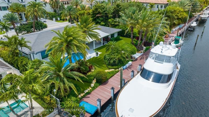 2375 Northeast 29th Street Lighthouse Point, FL 33064 - Photo 73 of 76 an aerial view of a house with a yard and garden