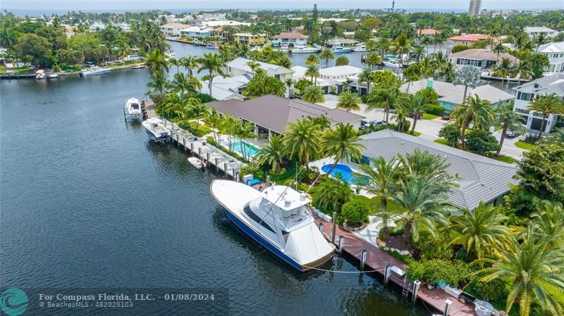 2375 Northeast 29th Street Lighthouse Point, FL 33064 - Photo 74 of 76 an aerial view of a house with a yard and lake view