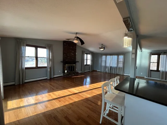 a view of a kitchen with a sink and a large window