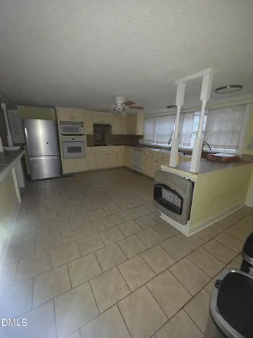 a kitchen with cabinets and a sink