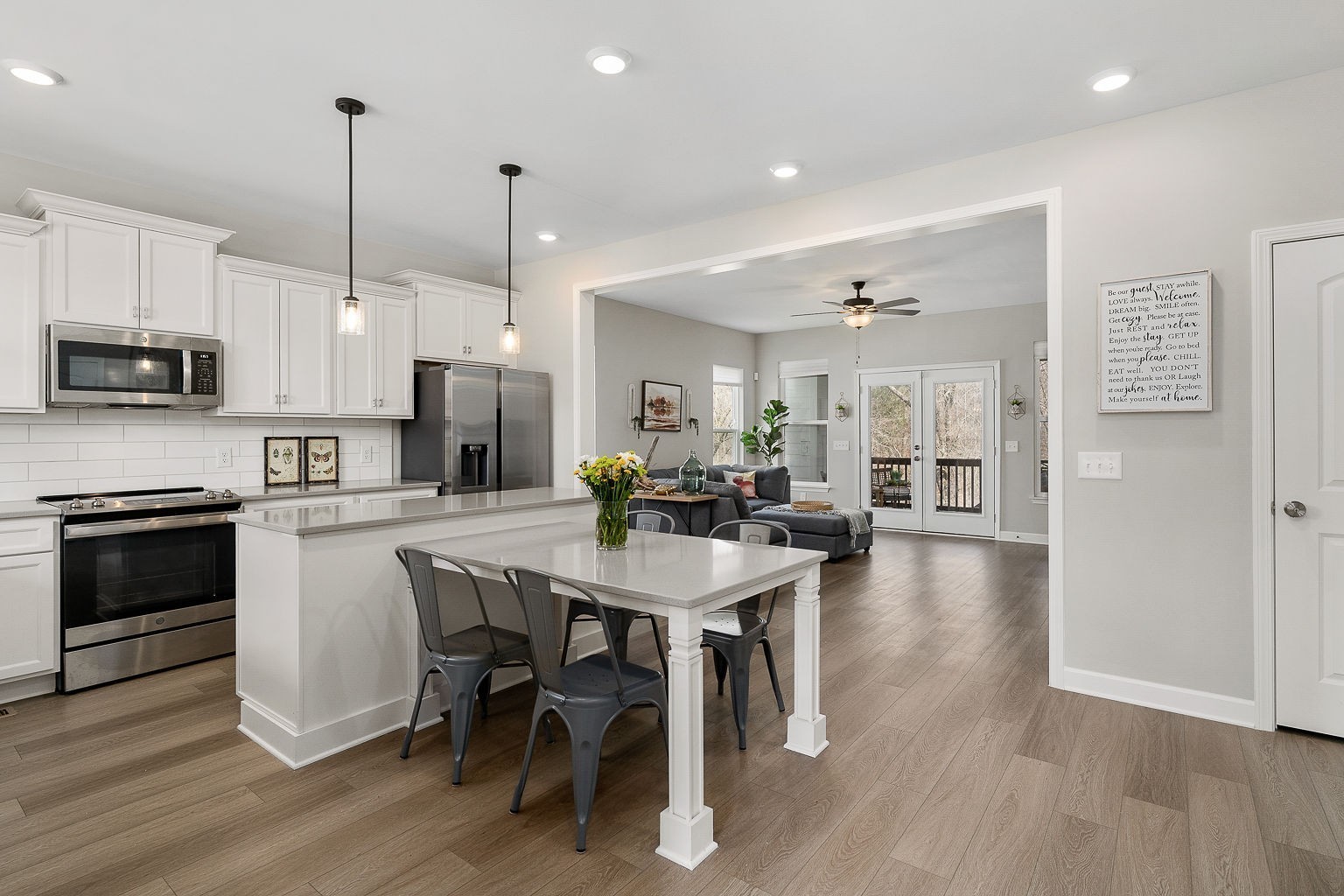 324 Evans Drive Tullahoma, TN 37388 - Photo 13 of 53 a kitchen with stainless steel appliances granite countertop a stove top oven a refrigerator a sink and chairs