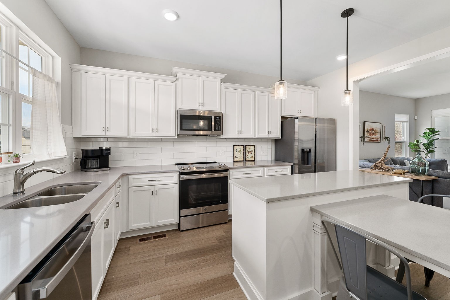 324 Evans Drive Tullahoma, TN 37388 - Photo 14 of 53 a kitchen with a sink a stove a refrigerator and cabinets