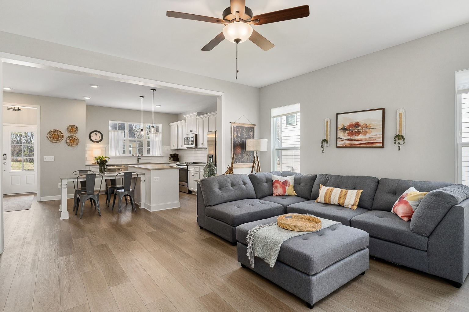 324 Evans Drive Tullahoma, TN 37388 - Photo 18 of 53 a living room with furniture and a dining table with wooden floor