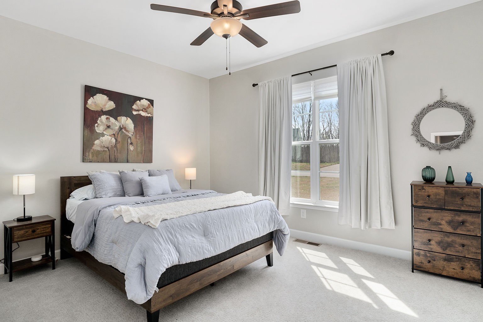 324 Evans Drive Tullahoma, TN 37388 - Photo 32 of 53 a bedroom with a bed and dresser with mirror