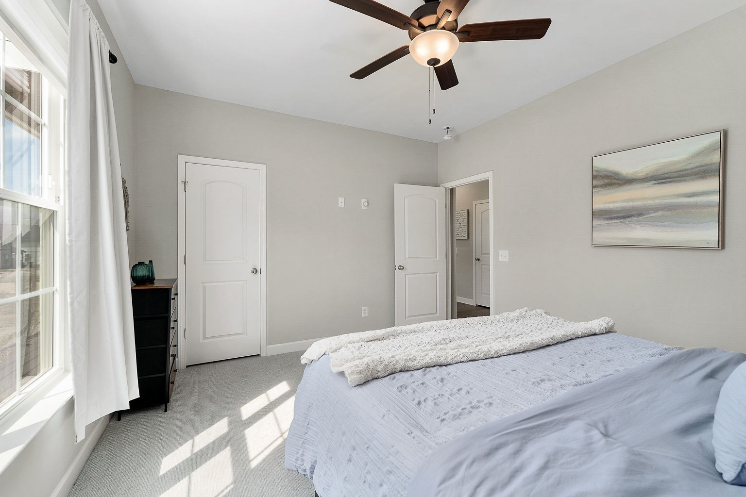 324 Evans Drive Tullahoma, TN 37388 - Photo 33 of 53 a bedroom with a large bed and a chandelier