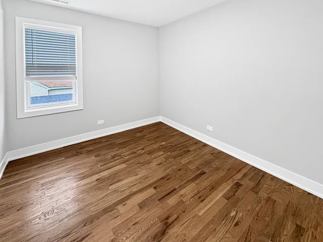a view of wooden floor in an empty room