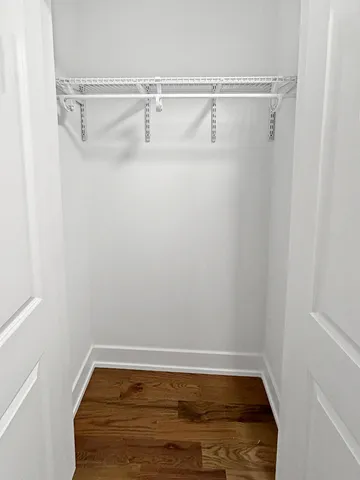 a bathroom with a granite countertop shower and a sink