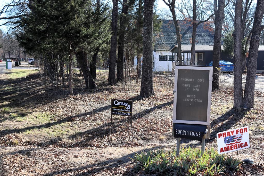 Tbd Live Oak Street Quinlan, TX 75474 - Photo 12 of 16 a view of a street with large trees