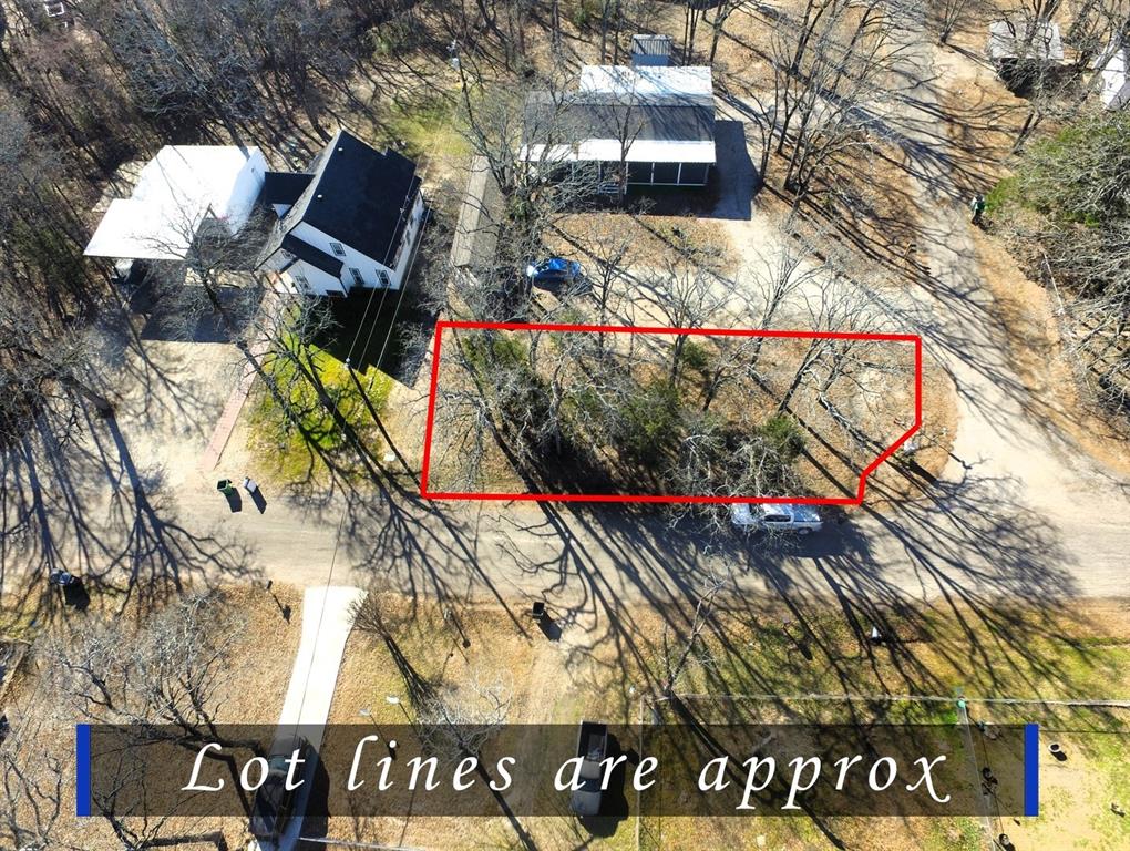 Tbd Live Oak Street Quinlan, TX 75474 - Photo 2 of 16 a view of a sign board and a street