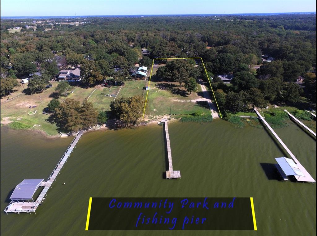 Tbd Live Oak Street Quinlan, TX 75474 - Photo 5 of 16 an aerial view of residential houses with outdoor space