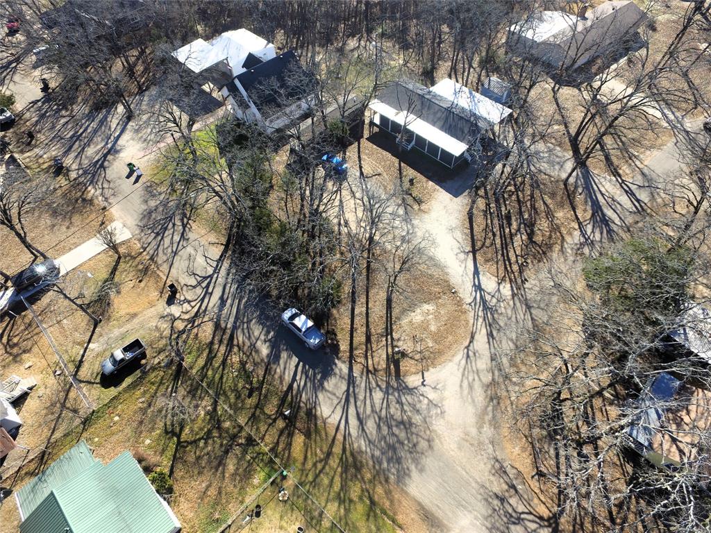 Tbd Live Oak Street Quinlan, TX 75474 - Photo 6 of 16 a view of a tree in a backyard of a house