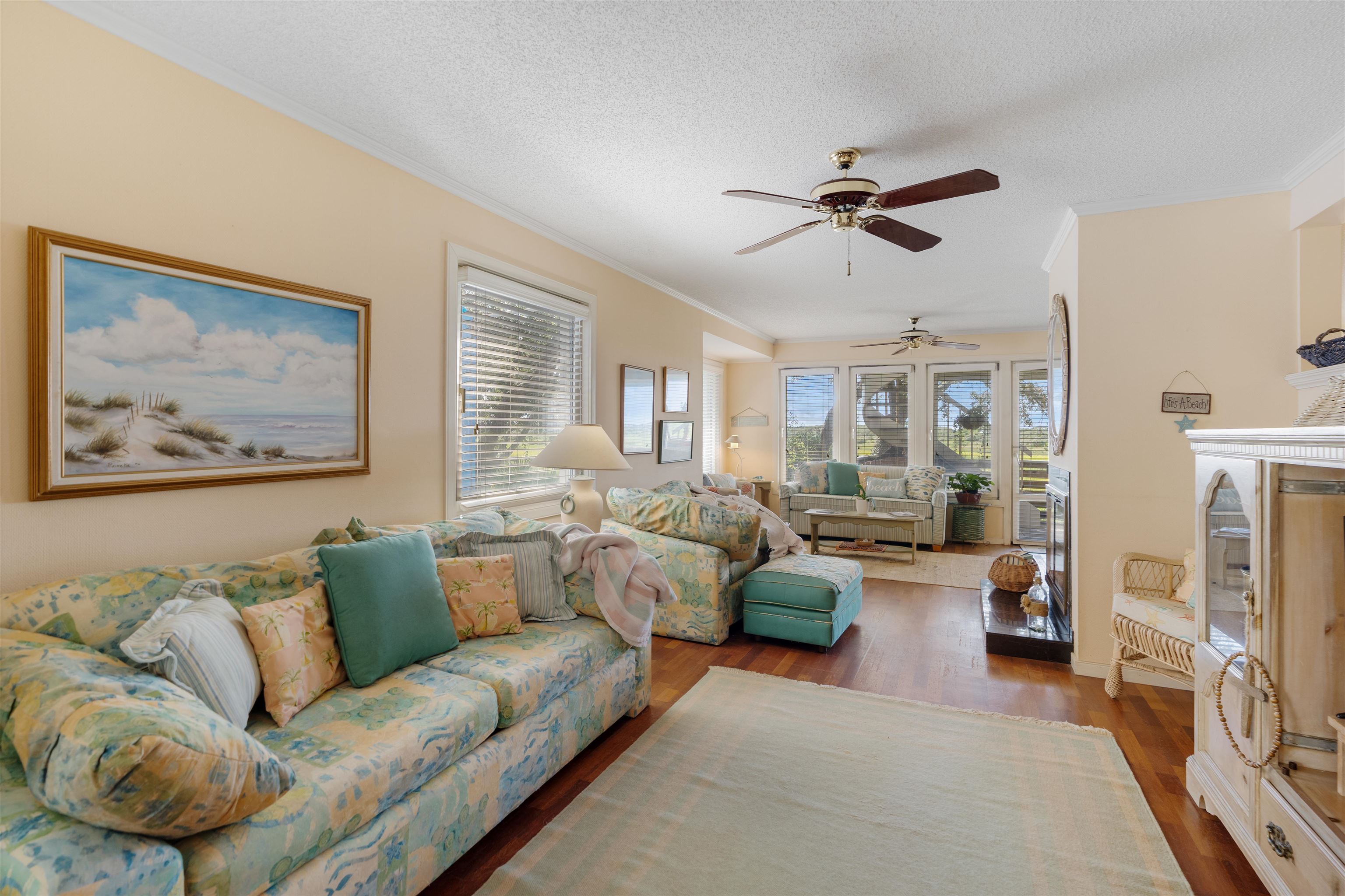547 Carcaba Road St. Augustine, FL 32084 - Photo 11 of 42 a living room with furniture and a fireplace