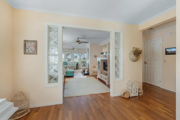 a view of a livingroom with furniture and wooden floor