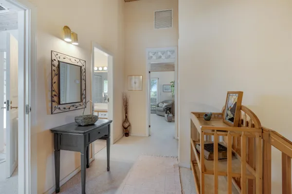 a view of a livingroom with furniture and front view of a house