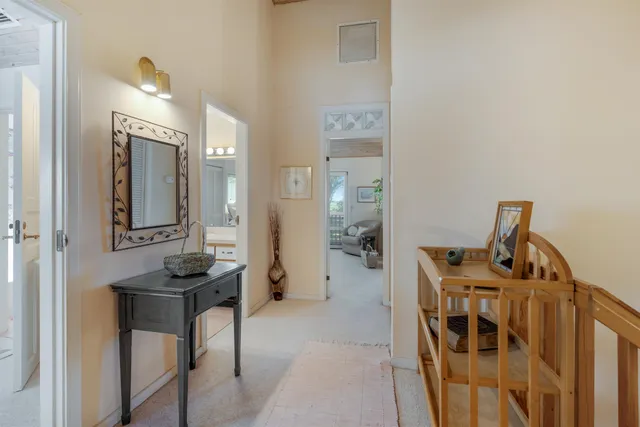 a view of a livingroom with furniture and front view of a house