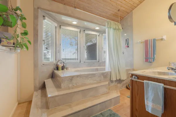 a bathroom with a sink and a bathtub