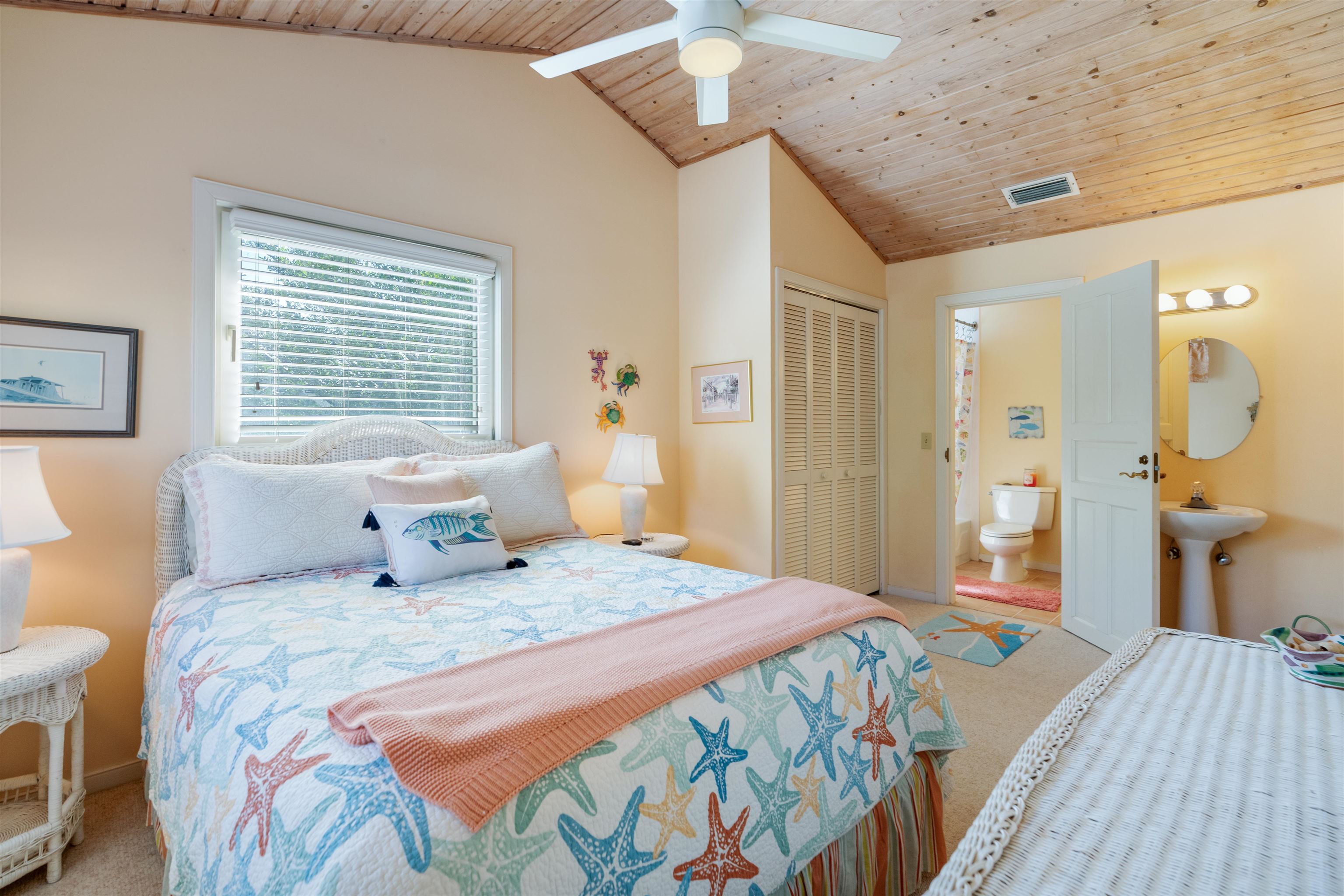 547 Carcaba Road St. Augustine, FL 32084 - Photo 19 of 42 a bedroom with a bed and a chandelier