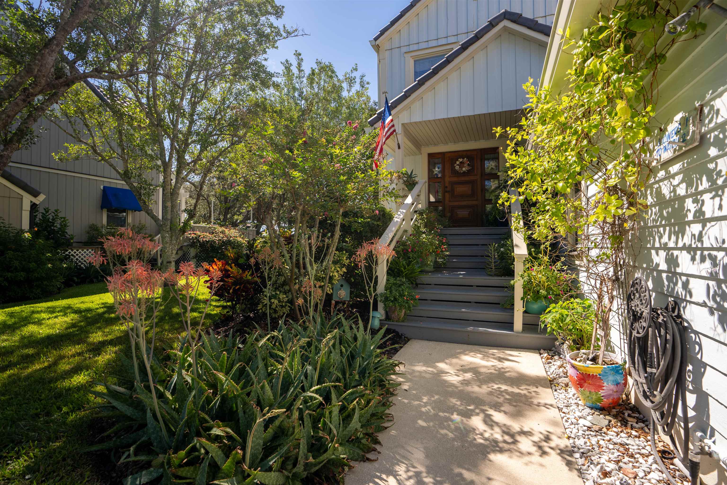 547 Carcaba Road St. Augustine, FL 32084 - Photo 26 of 42 a front view of a house with a yard
