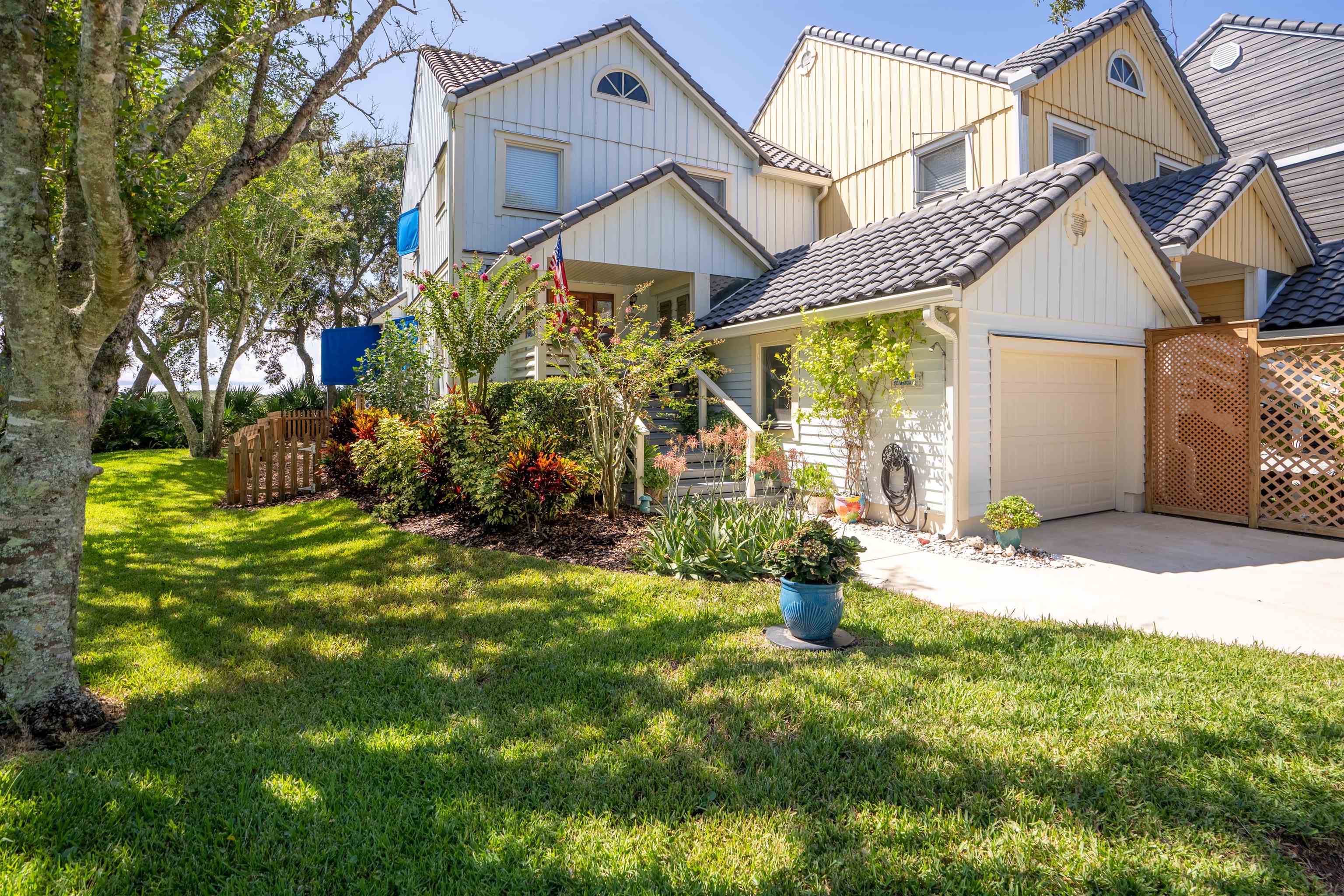547 Carcaba Road St. Augustine, FL 32084 - Photo 27 of 42 a view of a house with a small yard and sitting area
